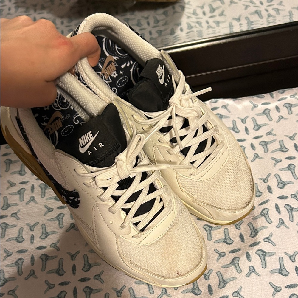 Nike Air White and Black Sneakers with Gold Accents